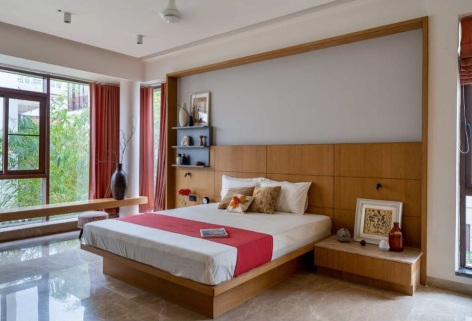 Bedroom with timber headboard wall